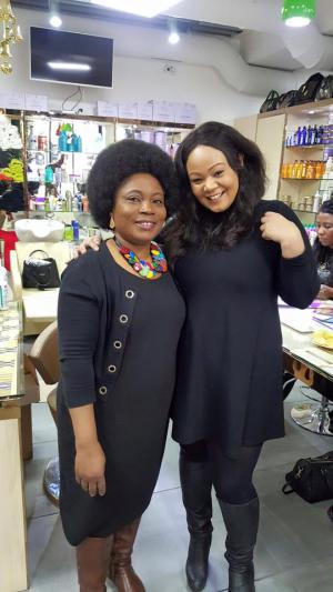 Two ladies posing for the camera dressed in black