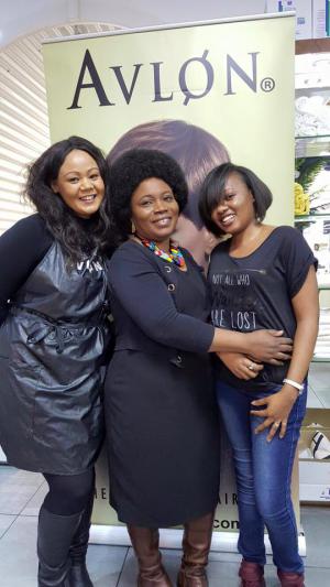 3 ladies posing inform on Avlon poster