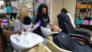 Customer receiving a hair rinse