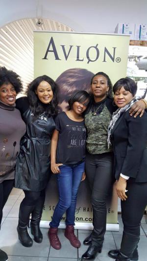 5 ladies posing inform on Avlon poster