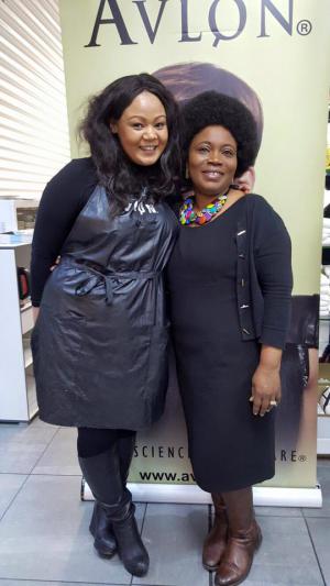 2 ladies posing inform on Avlon poster